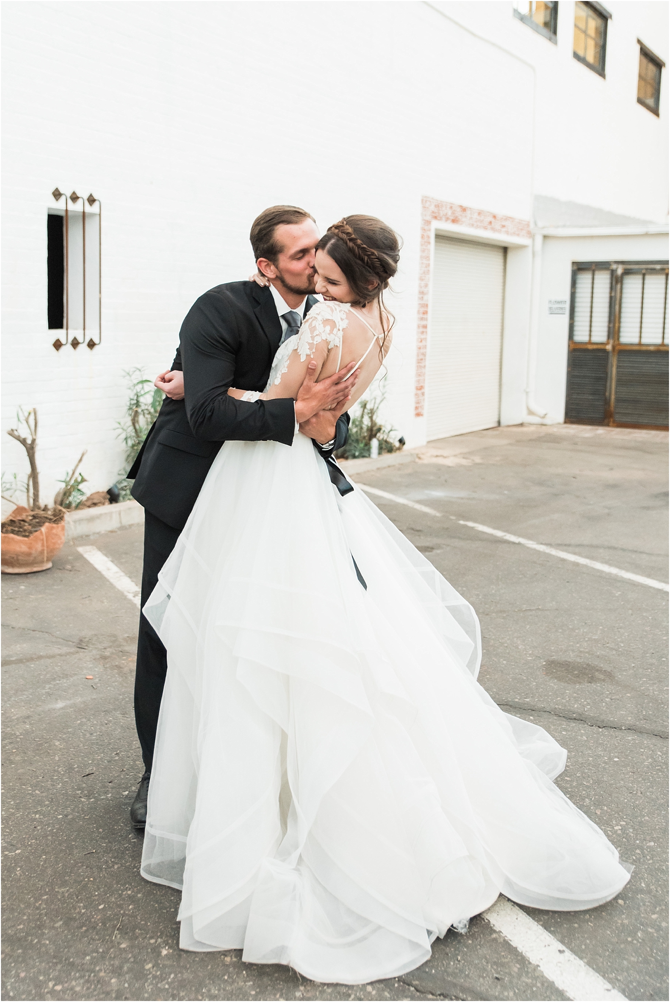 Bride and Groom snuggle and kiss during a wedding | Tucson Wedding Photographer | Bryan & Anh of West End Photography